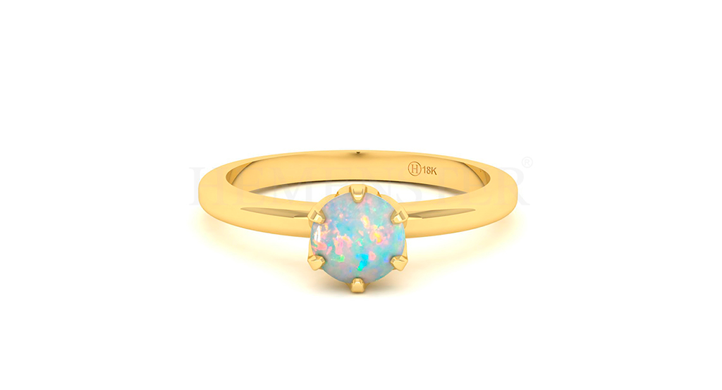 Anillo de oro con gemas de colores