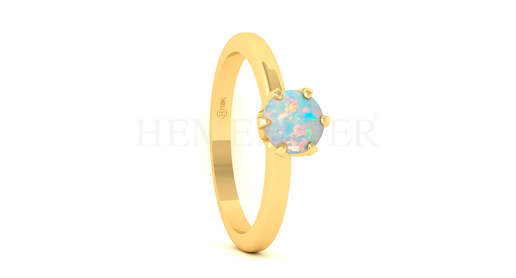 Anillo de oro con gemas de colores
